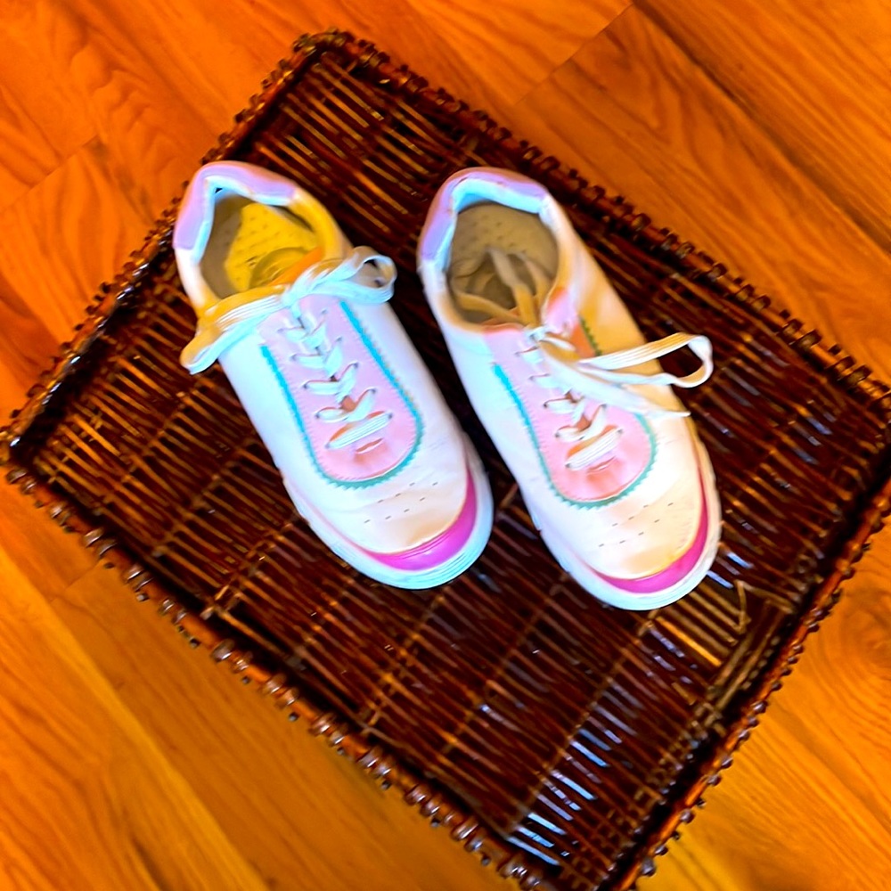 Walking shoes. It says the size is 5 but it feels like a 7. Runs wide